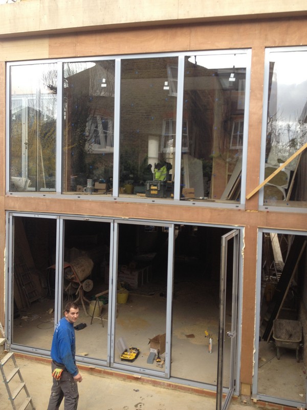 Aluminium bi-fold doors with two-storey glazing in West Drayton