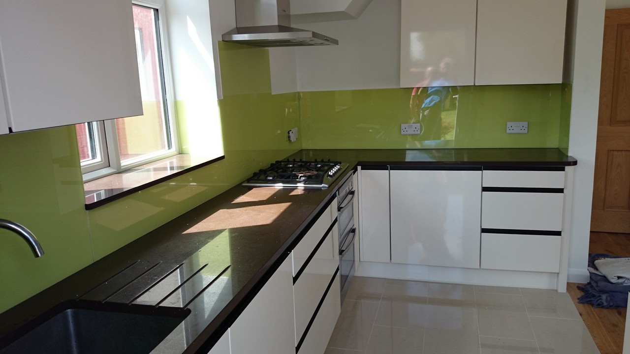 Lime green glass kitchen splashback installed by West Drayton glaziers