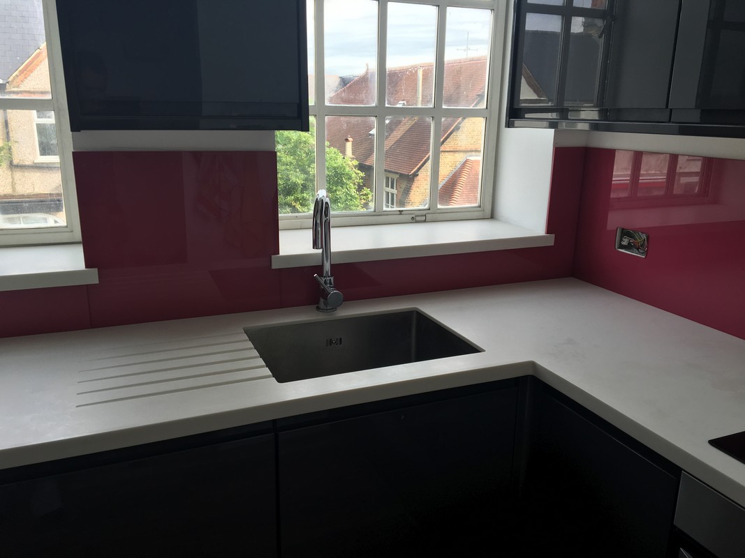 Deep plum coloured glass splashback in modern West Drayton kitchen